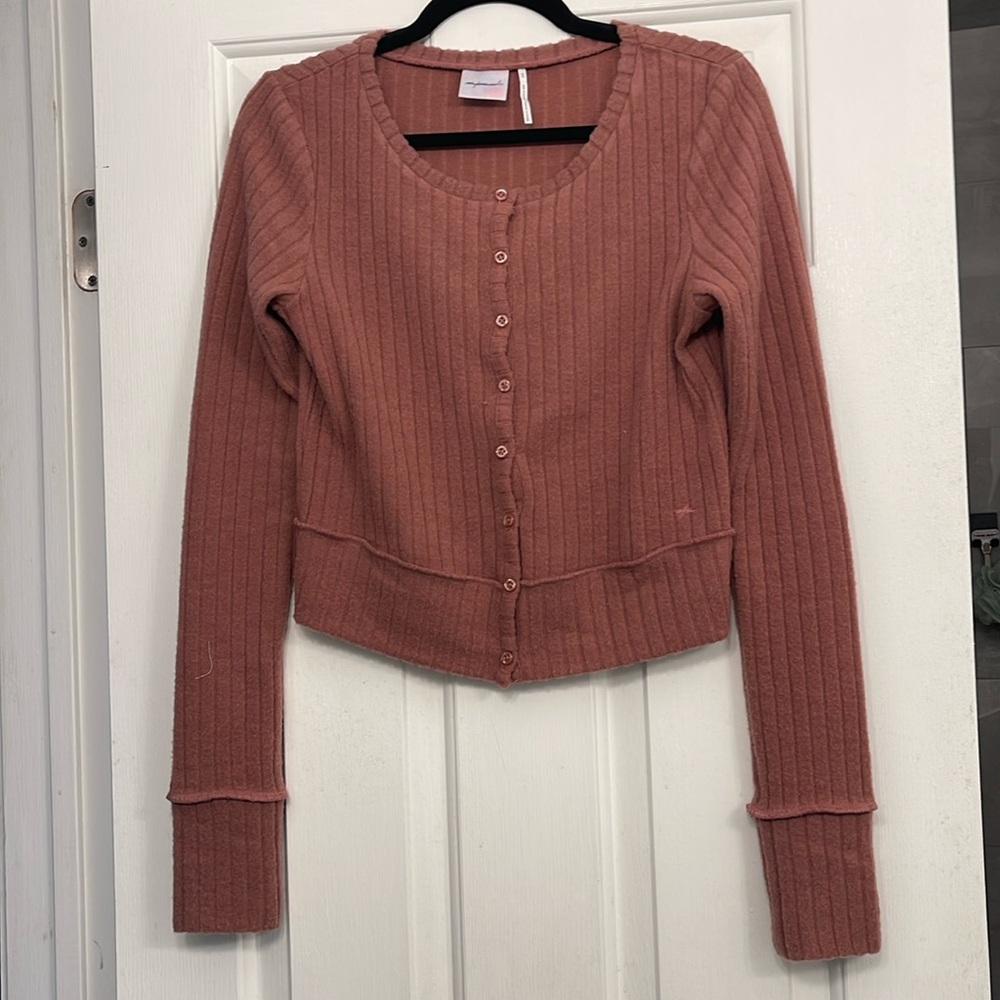 Out from under cardigan
